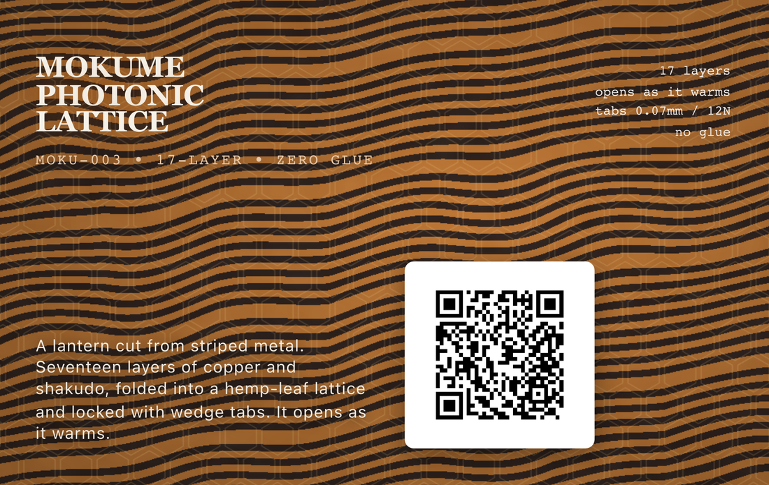 A card printed edge to edge with copper and black wood grain, titled Mokume Photonic Lattice, with a code to scan